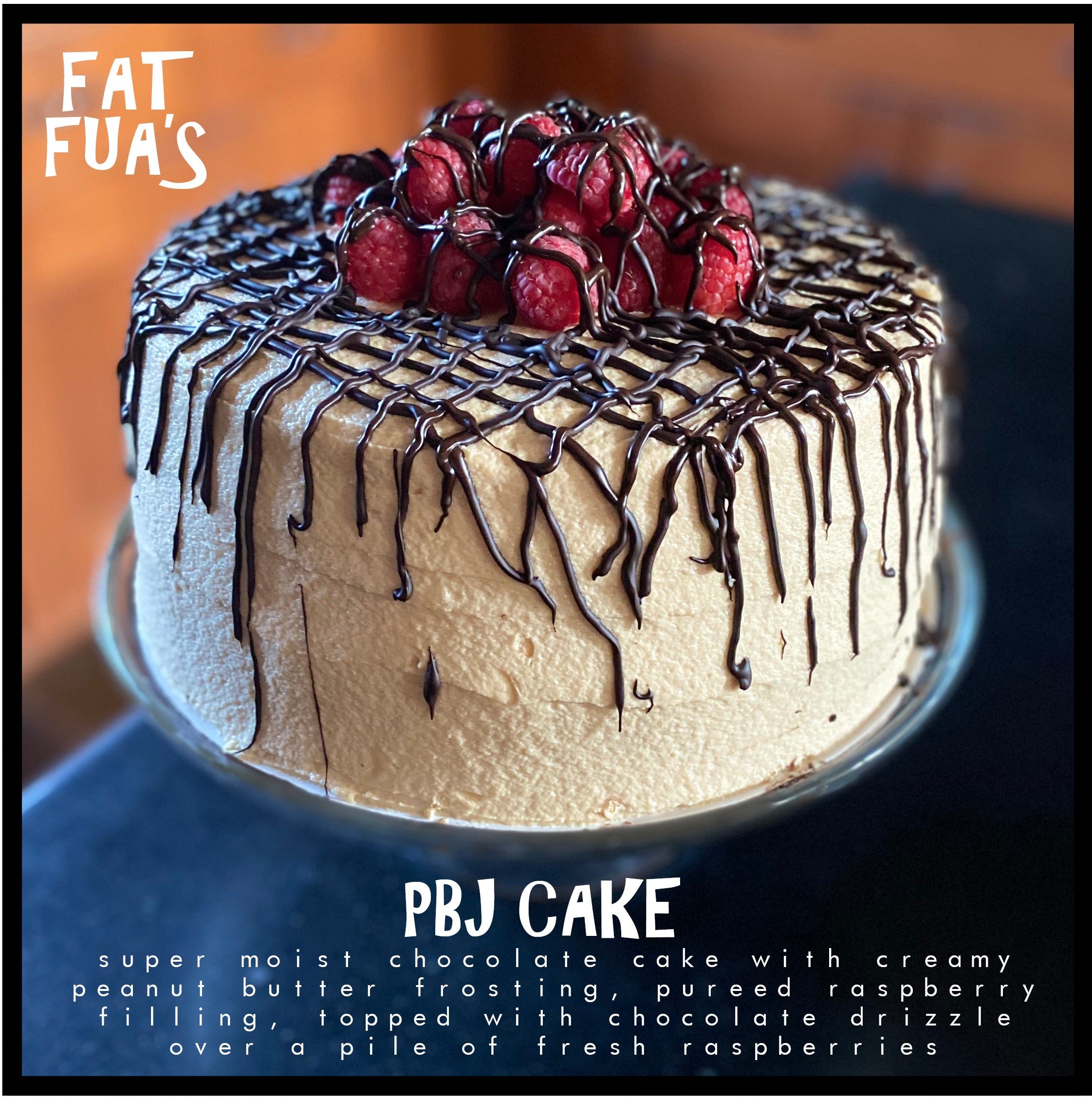 FAT size Super moist PBJ Cake, 2 layers of Chocolate Cake with Creamy Peanut Butter Frosting, pureed Raspberry filling, topped with Chocolate Drizzle over a pile of Fresh Raspberries.