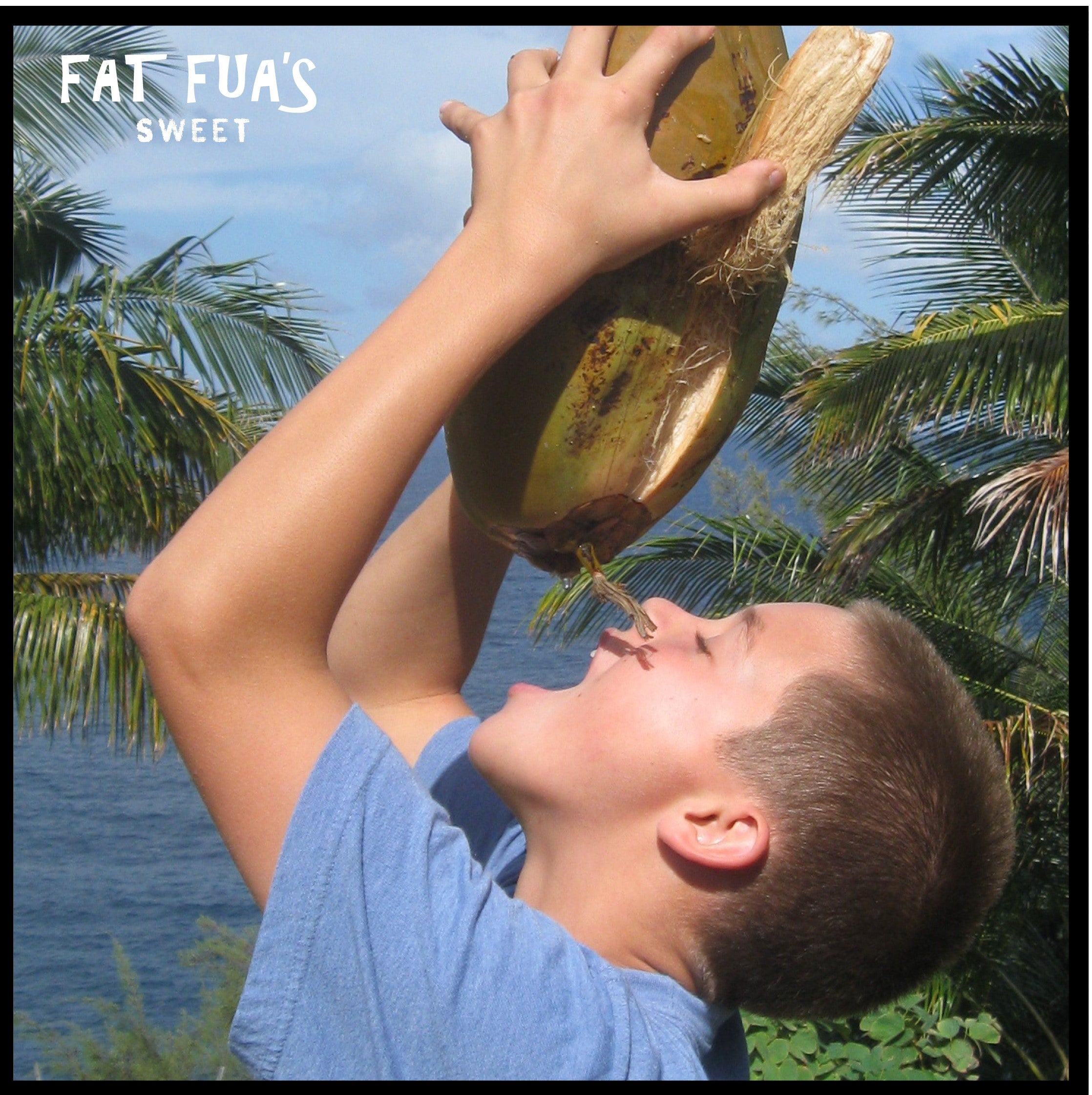 Small Fua Boy Drinking Coconut Milk From a Fresh Picked Coconut On Hawaii