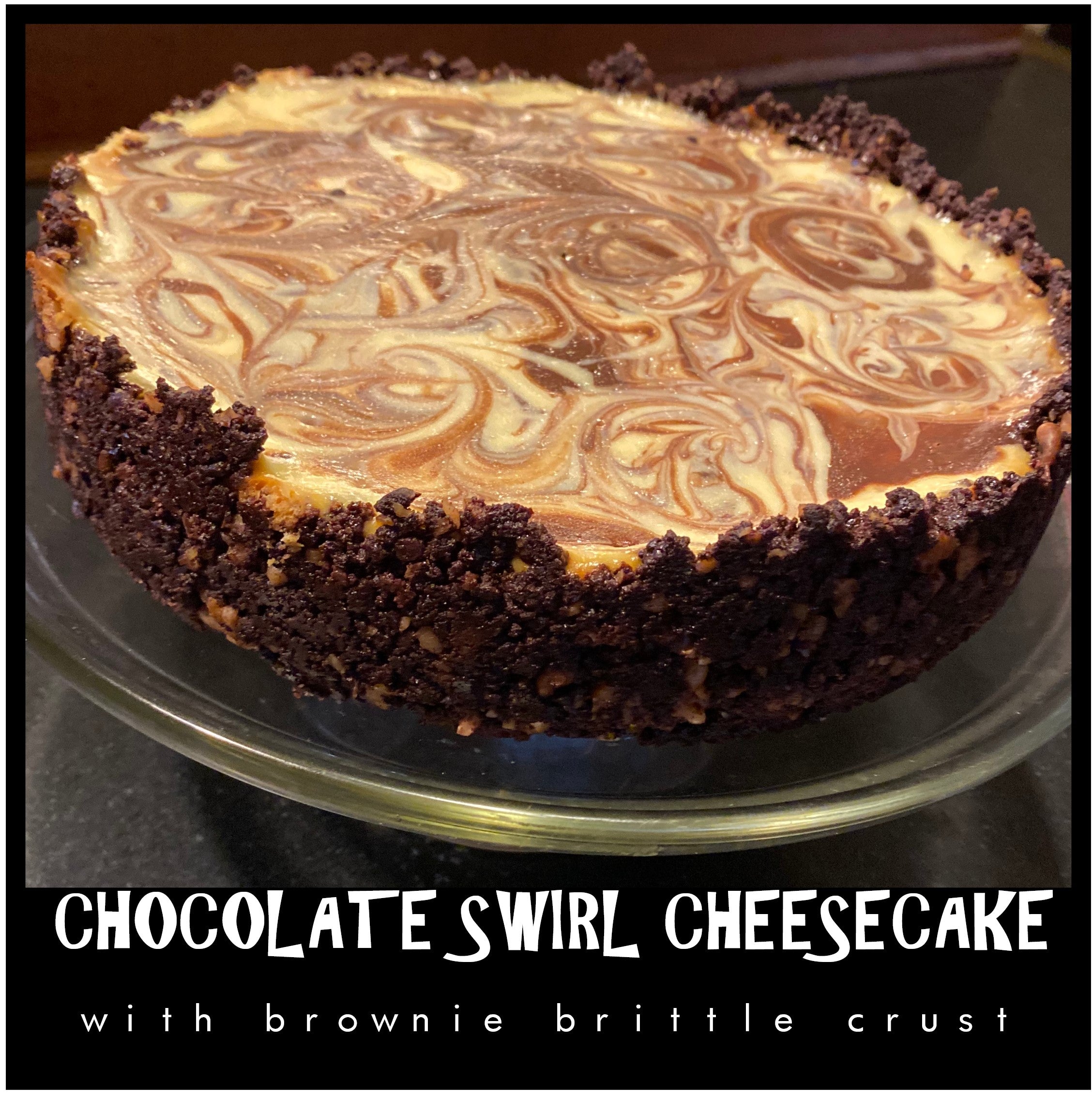 Close up photo of creamy chocolate swirl cheesecake with hand pressed brownie brittle crust made from scratch