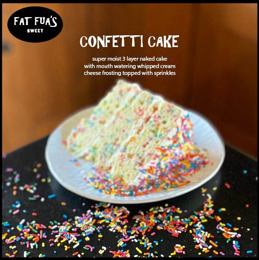 Slice of 3 layer confetti cake made with moist vanilla cake and whipped cream cheese frosting and covered with rainbow sprinkles spilling over the sides of the plate