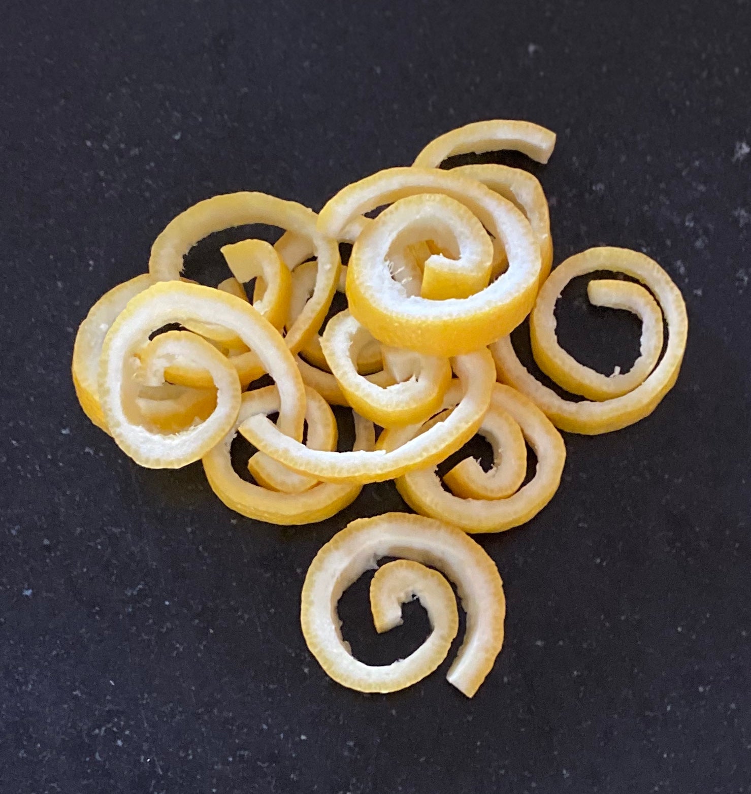 Pile of fresh lemon curls in preparation to be "candied" 