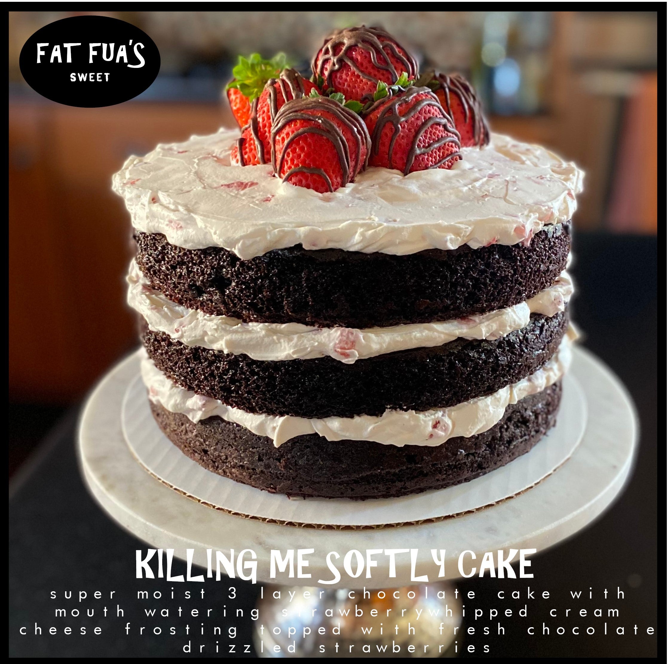 Fat size Killing Me Softly  stacked 3 layer cake made with moist dark chocolate cake and strawberries and cream frosting between the layers finished off with a pile of chocolate drizzled strawberries on top