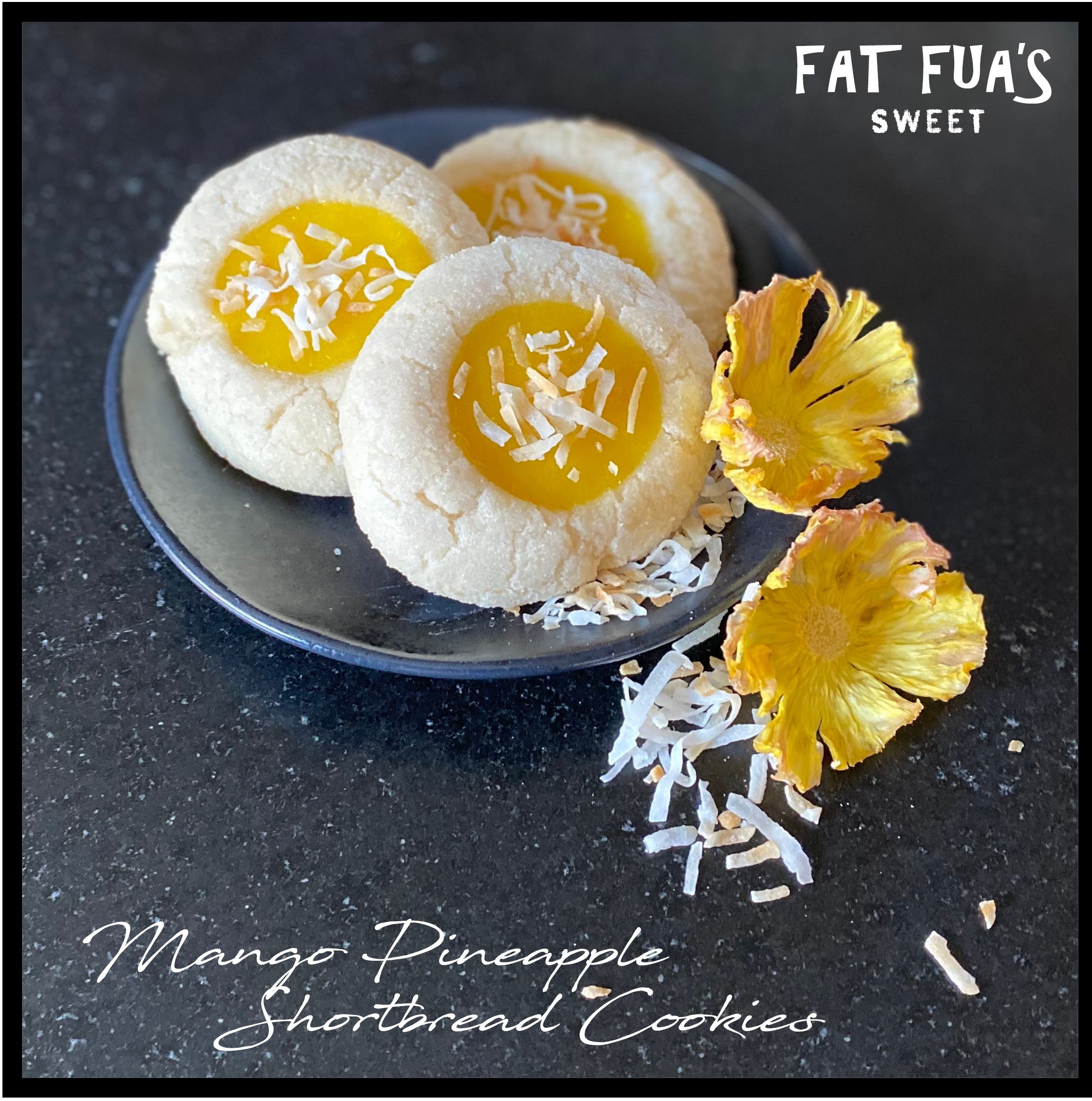 Made From Scratch Shortbread Cookies Filled with Yummy Mango and Pineapple Curd Topped with Toasted Coconut.  Displayed on a plate next to flowers made from pineapples.