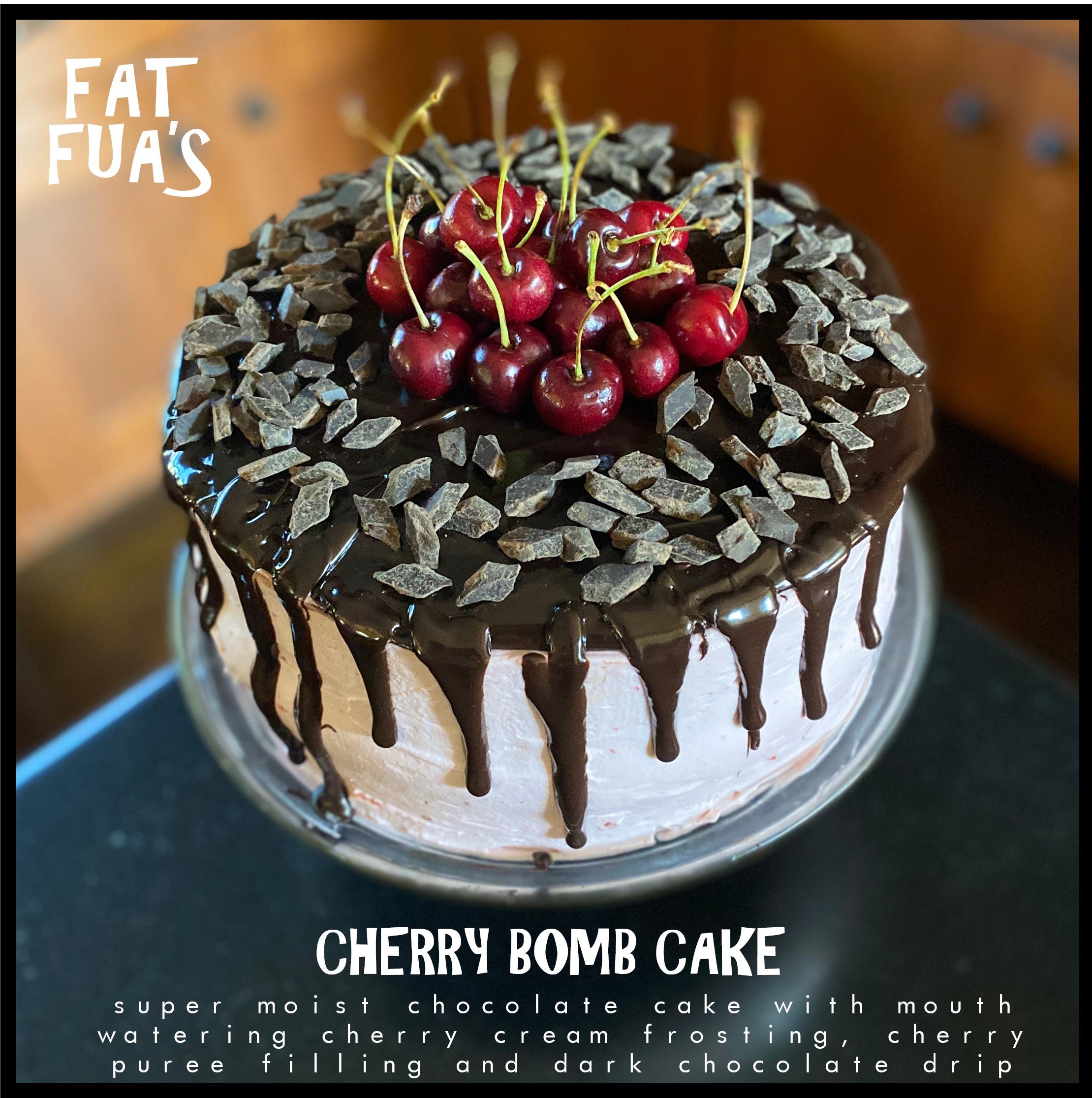 Fat size Cherry Bomb cake made with rich dark chocolate cake and whipped cherry cream cheese frosting and dark chocolate ganache' drizzling down the sides of this giant 3 layer cake topped off with a pile of chocolate chips and fresh stemmed cherries