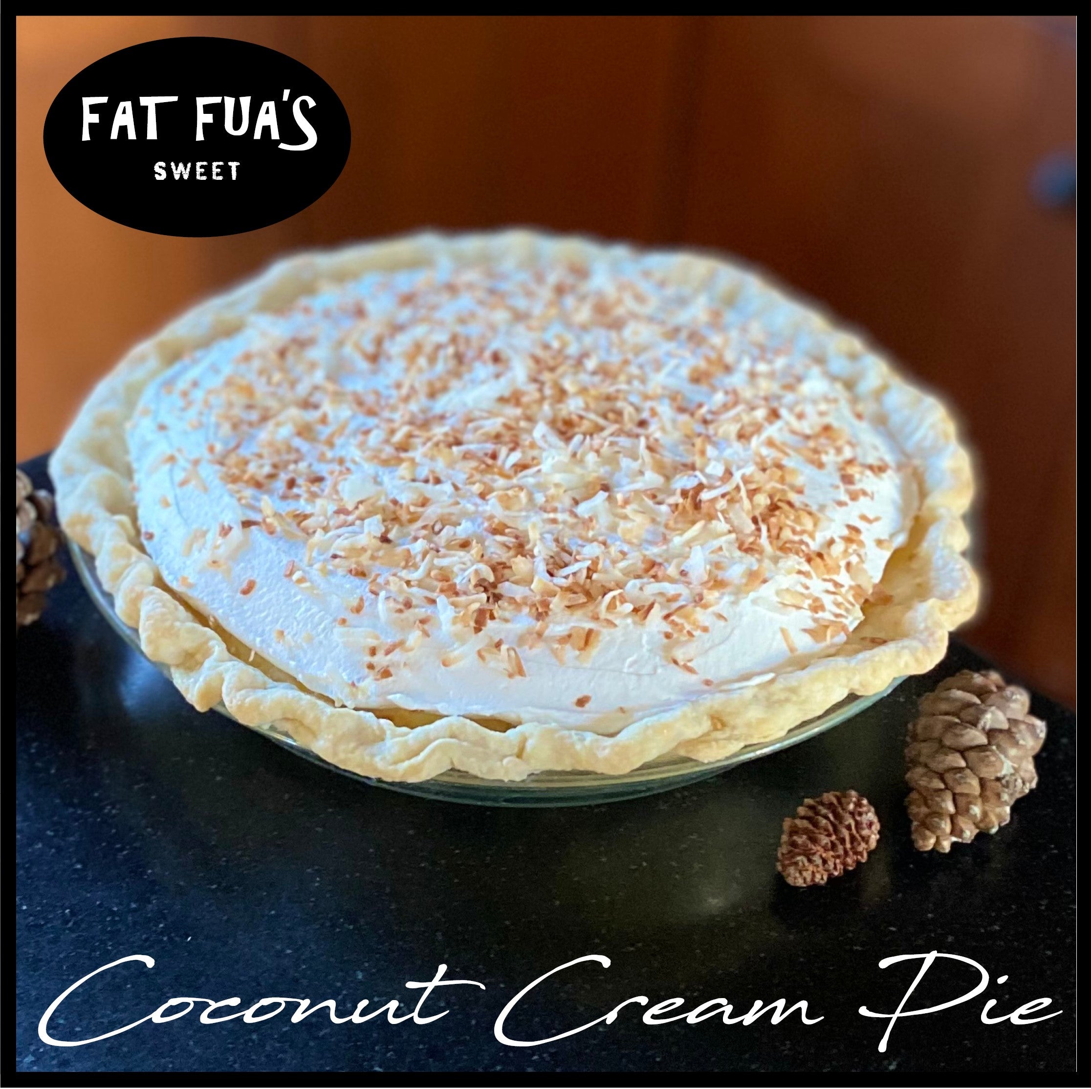 Coconut Cream pie piled high with fresh homemade whipped cream and toasted coconuts resting on the kitchen counter