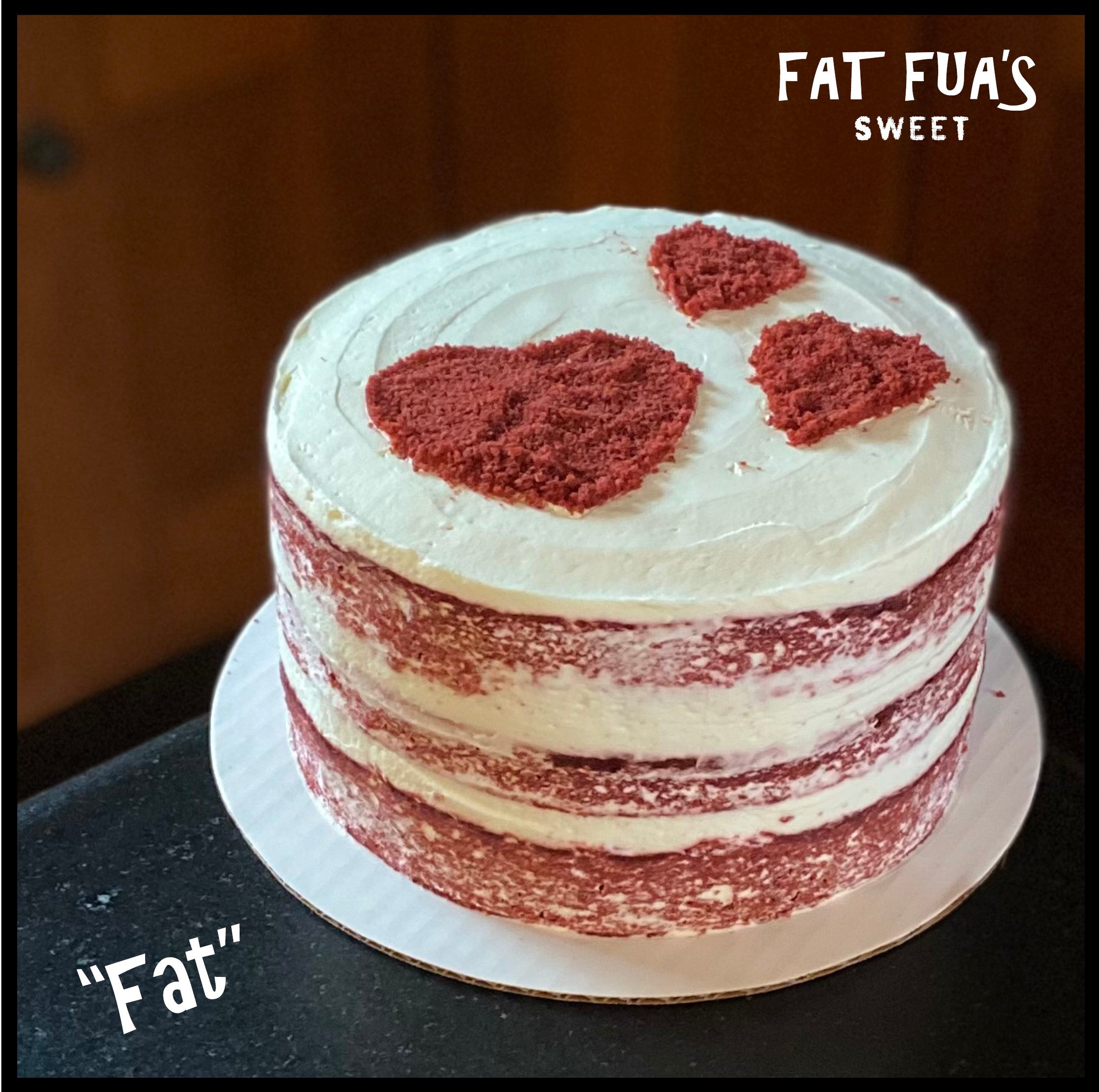 Fat size Red Velvet Cupids Cake 3 layers naked red velvet cake with whipped cream cheese frosting with Trio of red velvet hearts stenciled on top