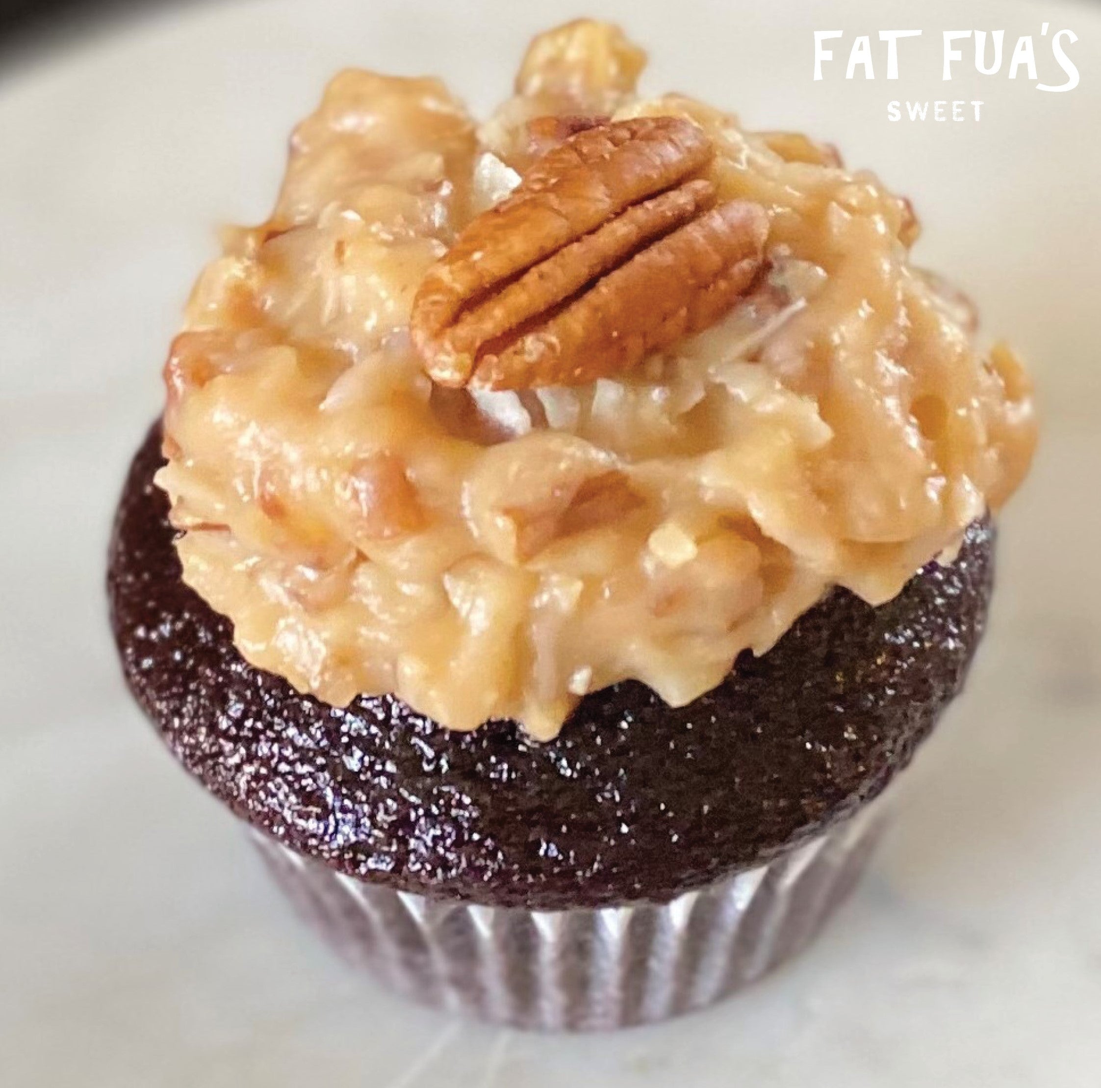 Moist Chocolate Cupcake Topped with our Buttery Pecan available by the dozen