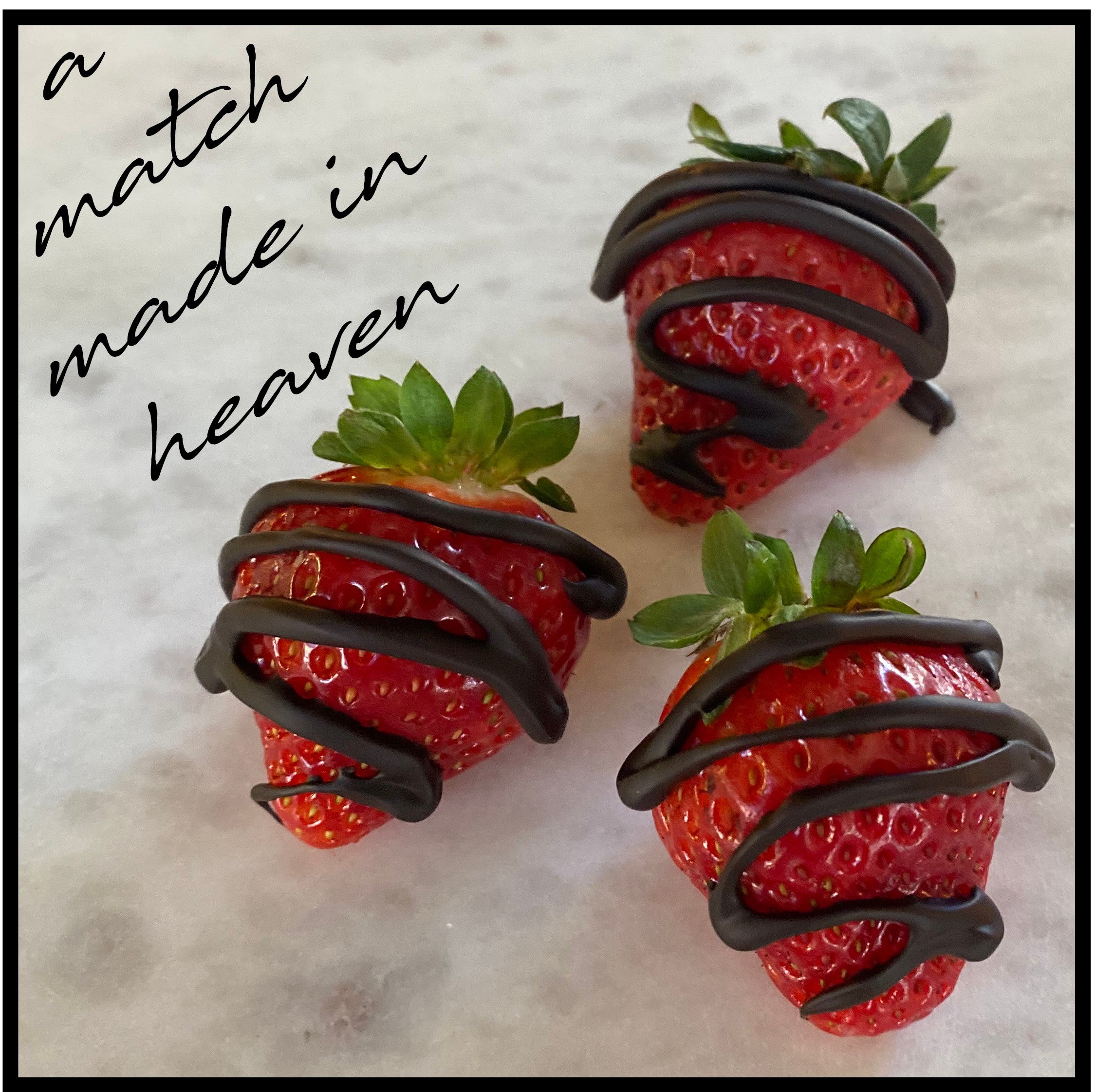 Close-up of 3 chocolate drizzled strawberries