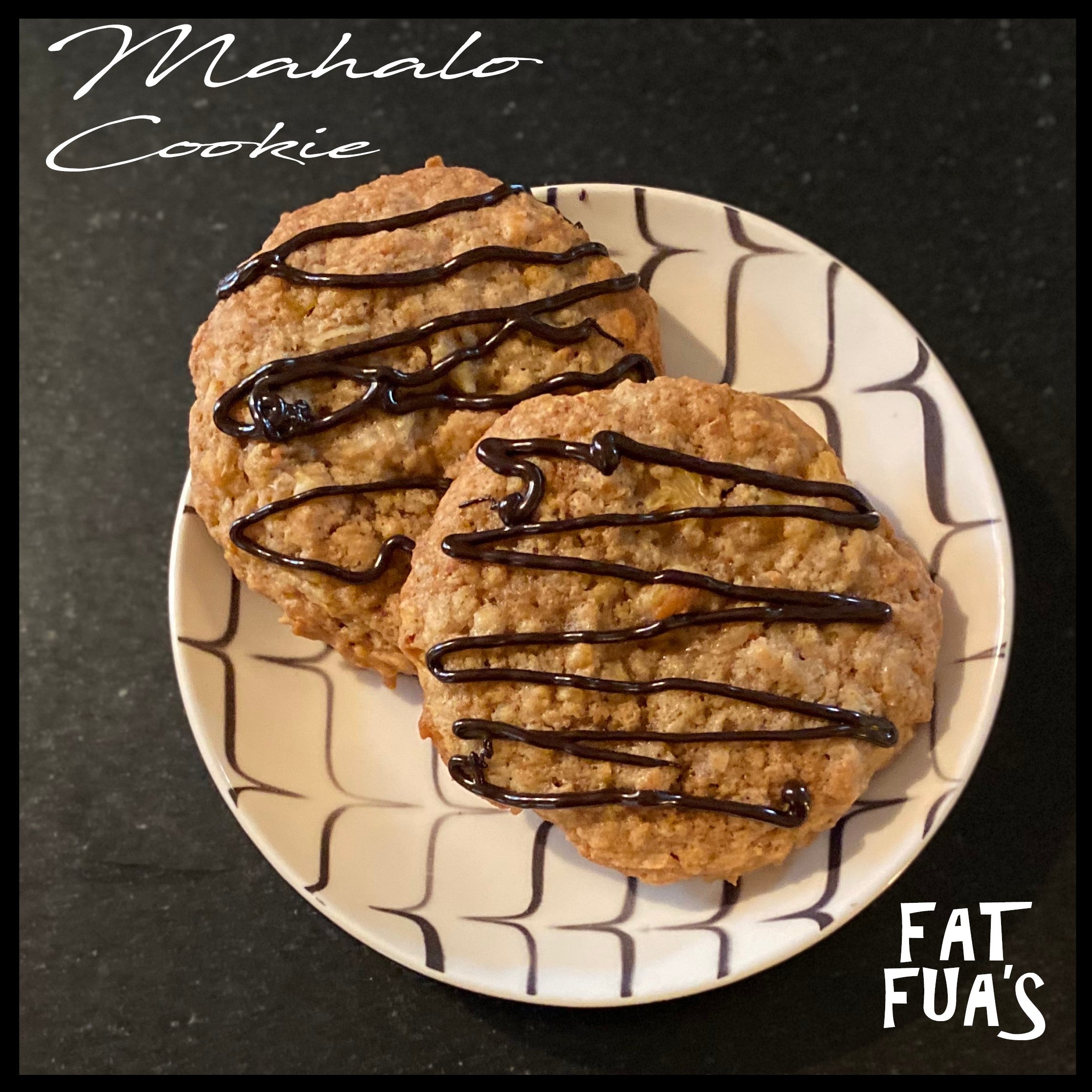 Two Deliscious Mahola cookies with roasted almonds pineapple and coconut are drizzled with dark chocolate