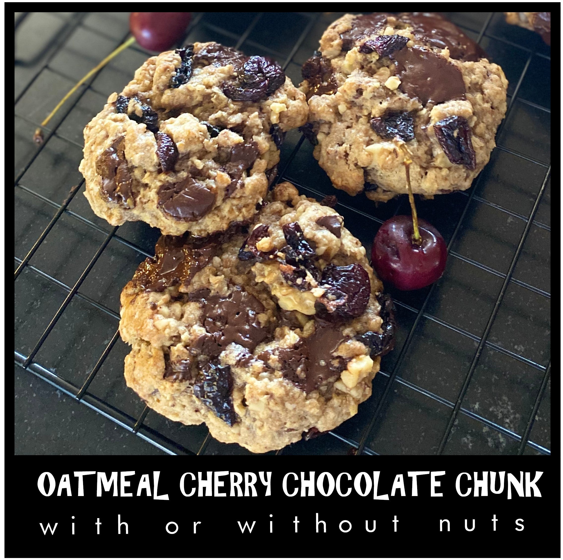 3 fresh oatmeal cherry chocolate chunk cookies cooling on a baking rack