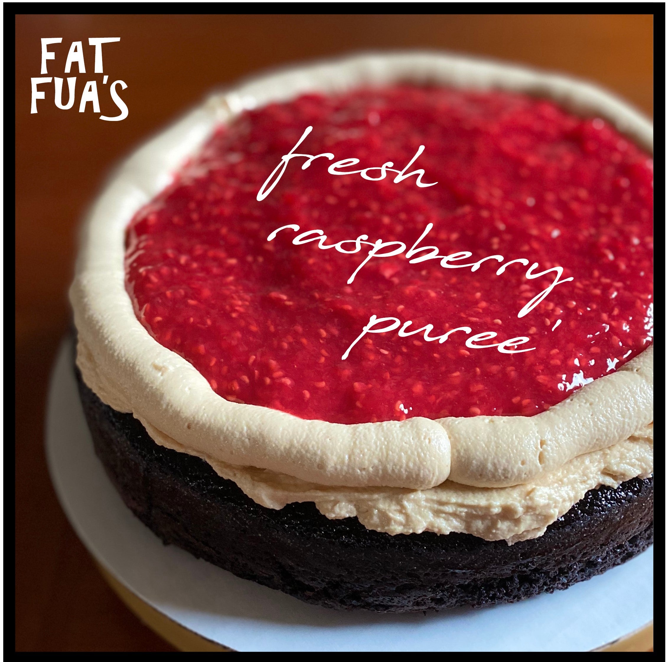 Inside view of PBJ cake showing layer of Raspberry Puree' resting on Creamy Peanut Butter Frosting and Moist dark chocolate cake