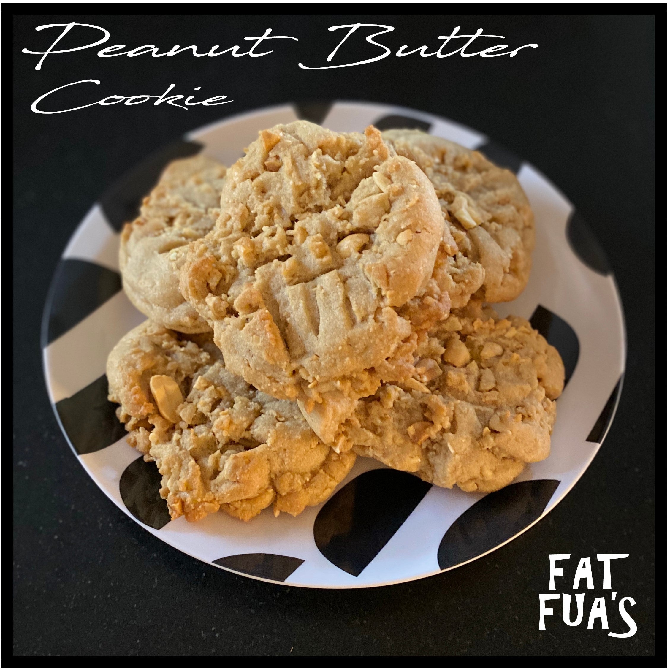 five nutty peanut butter cookies staked on a black and white spotted plate