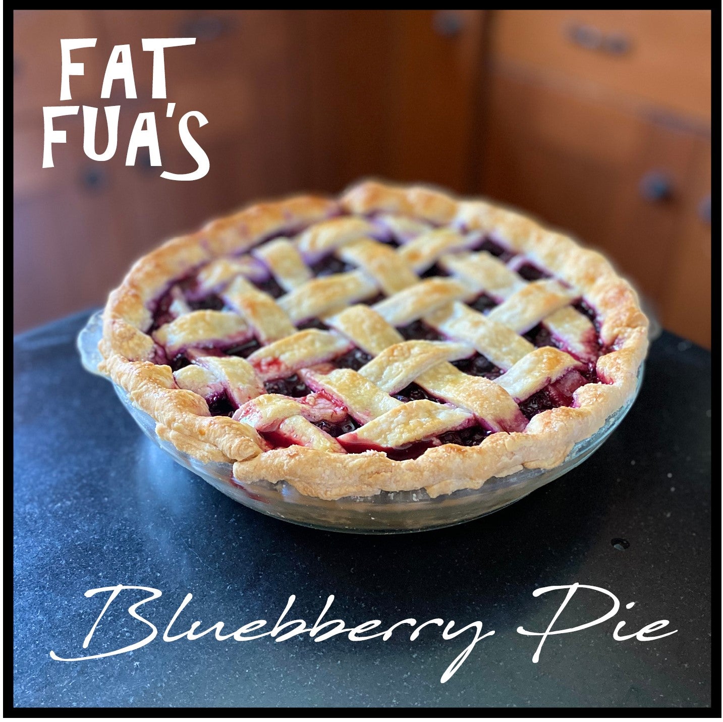 Freshly baked Blueberry Pie with golden lattice top resting on the kitchen counter